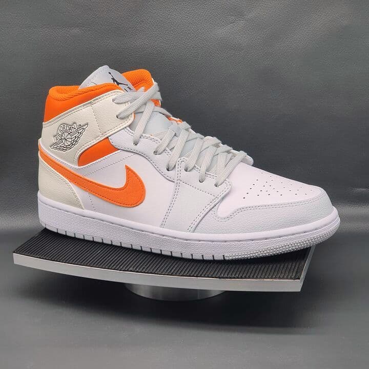 Air Jordan 1 Mid in Weiß und Orange